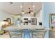 This bright kitchen includes a breakfast bar with pendant lights, stainless steel appliances, and stylish seating for a modern vibe at 9211 Koma St, Port Charlotte, FL 33981