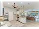 This updated kitchen offers stainless steel appliances, granite countertops, and a layout open to a comfortable living space at 9211 Koma St, Port Charlotte, FL 33981