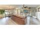 Open-concept living room and dining area with wood flooring and plenty of natural light at 9211 Koma St, Port Charlotte, FL 33981