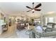 Spacious living area featuring hardwood floors and an open layout, perfect for entertaining at 9211 Koma St, Port Charlotte, FL 33981