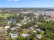 Aerial view of a residential community with houses near lakes and golf courses at 1 Curacao Cir # 44, Englewood, FL 34223