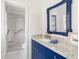 Stylish bathroom showcasing a marble countertop, vanity, and a walk-in shower at 1 Curacao Cir # 44, Englewood, FL 34223