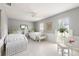 Bright bedroom featuring two twin beds, neutral colors and an abundance of natural light at 1 Curacao Cir # 44, Englewood, FL 34223