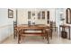 Dining room with traditional wood furniture, tile floors, and built-in cabinetry at 1 Curacao Cir # 44, Englewood, FL 34223
