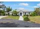 Charming single-story home with an attached carport, manicured lawn, and inviting entrance at 1 Curacao Cir # 44, Englewood, FL 34223