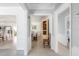 Bright hallway with views into the dining area and living space, showcasing the home's open layout at 1 Curacao Cir # 44, Englewood, FL 34223