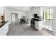 Bright kitchen showcasing stainless steel appliances, sleek countertops, and modern cabinetry at 1 Curacao Cir # 44, Englewood, FL 34223