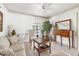 Inviting living room with a cozy sofa, stylish decor, and ample natural light at 1 Curacao Cir # 44, Englewood, FL 34223