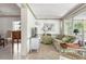 Cozy living room featuring neutral tones, comfortable seating, and large windows at 1 Curacao Cir # 44, Englewood, FL 34223