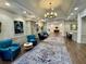 Comfortable lobby featuring stylish seating, elegant rugs, and tasteful artwork in a welcoming atmosphere at 1 Curacao Cir # 44, Englewood, FL 34223