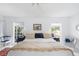Airy main bedroom featuring windows with lots of natural light and ceiling fan at 1 Curacao Cir # 44, Englewood, FL 34223