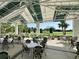 Inviting patio with ample seating and lush landscaping, perfect for outdoor dining and relaxation at 1 Curacao Cir # 44, Englewood, FL 34223