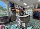 Pro shop featuring golf clubs, bags, and accessories displayed on shelves and racks with a geometric floor pattern at 1 Curacao Cir # 44, Englewood, FL 34223
