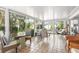 Inviting sunroom filled with natural light, cozy furniture, and a view of the outdoors at 1 Curacao Cir # 44, Englewood, FL 34223