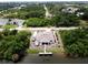 Aerial shot of waterfront home with private dock access to canal and beautifully landscaped grounds at 10064 Cocoa Beach St, Port Charlotte, FL 33981