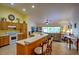 Open concept kitchen with barstool seating and view to living room at 10064 Cocoa Beach St, Port Charlotte, FL 33981