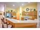 Bright and airy kitchen with breakfast bar and stainless steel appliances at 10064 Cocoa Beach St, Port Charlotte, FL 33981