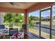 Charming screened-in lanai with view of the backyard and waterway at 10064 Cocoa Beach St, Port Charlotte, FL 33981