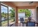 Relaxing screened lanai overlooking the lake and backyard at 10064 Cocoa Beach St, Port Charlotte, FL 33981