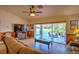 Cozy living room with a view of the lanai and backyard at 10064 Cocoa Beach St, Port Charlotte, FL 33981