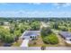 Overhead view of a charming neighborhood with lush landscaping and well-maintained homes at 129 David Blvd, Rotonda West, FL 33947