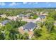 Aerial view of the home and fenced-in backyard with a screened-in porch at 129 David Blvd, Rotonda West, FL 33947