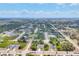 Aerial view of the neighborhood showcasing its layout, landscaping, and community at 129 David Blvd, Rotonda West, FL 33947