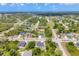 An aerial view capturing the community, showcasing its natural beauty, and the layout of homes at 129 David Blvd, Rotonda West, FL 33947