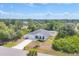 Nice aerial shot of a home, showcasing its surroundings within a leafy residential neighborhood at 129 David Blvd, Rotonda West, FL 33947