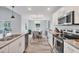 Open-concept dining area adjacent to a modern kitchen, perfect for entertaining and Gathering meals at 129 David Blvd, Rotonda West, FL 33947