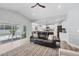 Open-concept living room flows into a modern kitchen, ideal for entertaining and gatherings at 129 David Blvd, Rotonda West, FL 33947