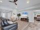 Spacious living room with TV and comfortable seating with an open floor plan at 129 David Blvd, Rotonda West, FL 33947