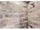 Close-up of a tiled shower with accent trim at 129 David Blvd, Rotonda West, FL 33947