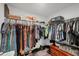 Organized walk-in closet with ample hanging space, shelving, and storage solutions for clothing and accessories at 129 David Blvd, Rotonda West, FL 33947