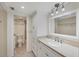 Well-lit bathroom with granite countertop, modern fixtures, and a walk-in shower at 149 Englewood Isles Pkwy # 603, Englewood, FL 34223