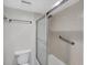 Clean bathroom features a shower with sliding glass doors and a neutral-toned tile surround at 149 Englewood Isles Pkwy # 603, Englewood, FL 34223
