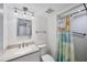 Inviting bathroom with updated fixtures, vanity with granite countertop, and decorative shower curtain at 149 Englewood Isles Pkwy # 603, Englewood, FL 34223