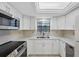 Well-equipped kitchen with stainless steel appliances and ample counter space at 149 Englewood Isles Pkwy # 603, Englewood, FL 34223