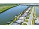 Beautiful waterfront homes line a canal in this aerial view featuring boat docks and lush landscaping at 15176 Spanish Point Dr, Port Charlotte, FL 33981