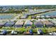 Aerial view highlighting a waterfront home with private boat dock and screened pool, offering luxurious outdoor living at 15176 Spanish Point Dr, Port Charlotte, FL 33981