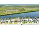 Waterfront homes with private boat docks are showcased in this aerial shot, highlighting luxurious canal-front living at 15176 Spanish Point Dr, Port Charlotte, FL 33981