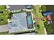 Aerial shot of a home with a screened in pool and access to the water at 15176 Spanish Point Dr, Port Charlotte, FL 33981