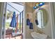 Half bath providing convenient access to the outdoor pool and patio area at 15176 Spanish Point Dr, Port Charlotte, FL 33981
