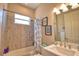 Bright bathroom with a shower-tub combo, stylish fixtures, and decorative accents at 15176 Spanish Point Dr, Port Charlotte, FL 33981