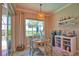 Cozy breakfast nook with water view and access to the lanai and pool at 15176 Spanish Point Dr, Port Charlotte, FL 33981