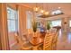 Open-concept dining room featuring modern pendant lighting and views into the living area at 15176 Spanish Point Dr, Port Charlotte, FL 33981