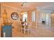 Well-lit dining room offering seating for six with views of the entryway and adjacent rooms at 15176 Spanish Point Dr, Port Charlotte, FL 33981