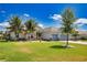 Charming home with a well-manicured lawn, features a three-car garage and beautiful landscaping at 15176 Spanish Point Dr, Port Charlotte, FL 33981