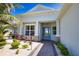 Inviting single-story home featuring a manicured front yard, stone accents, and a brick walkway to the front entrance at 15176 Spanish Point Dr, Port Charlotte, FL 33981