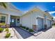 Beautiful single-story home with well-maintained landscaping, stone accents, and a brick walkway leading to the entrance at 15176 Spanish Point Dr, Port Charlotte, FL 33981